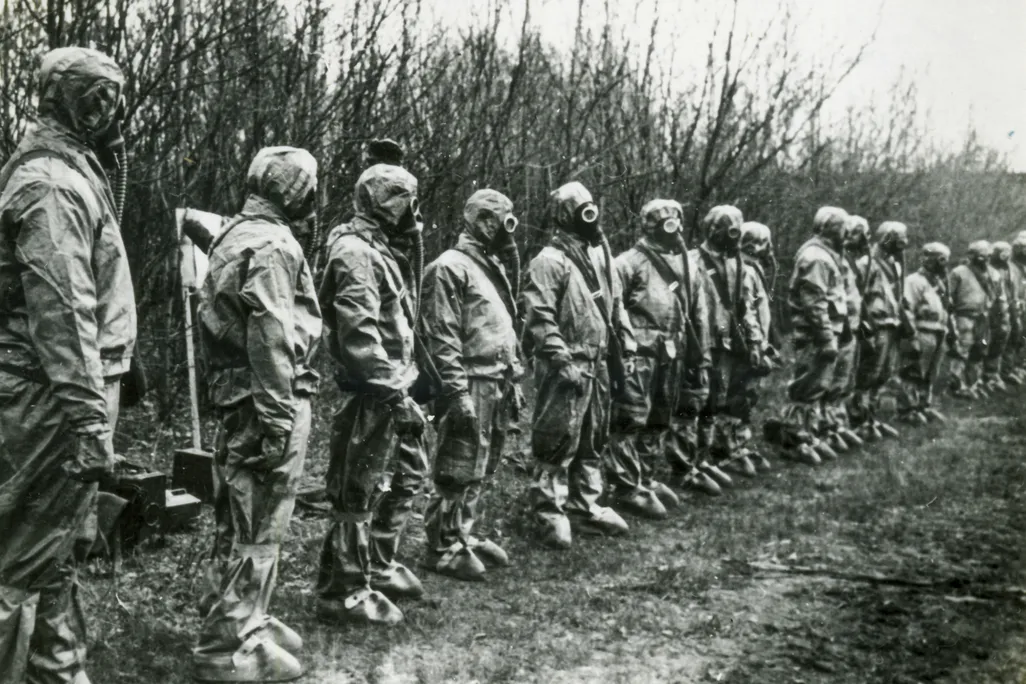 Masked liquidators in line to deal with the Chernobyl plant disaster