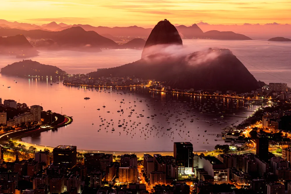 Boats, lights and fog help create a serene nighttime scene in Rio de Janeiro.