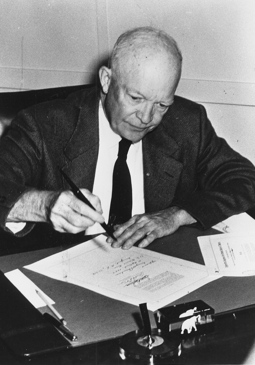 President Dwight D. Eisenhower signing the Civil Rights Act of 1957 into law