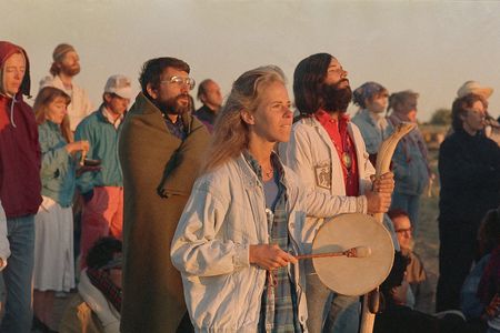 Campers near Chaco Canyon, N.M., gather together and look to the east to watch the sun rise on August 17, 1987, as part of the harmonic convergence.