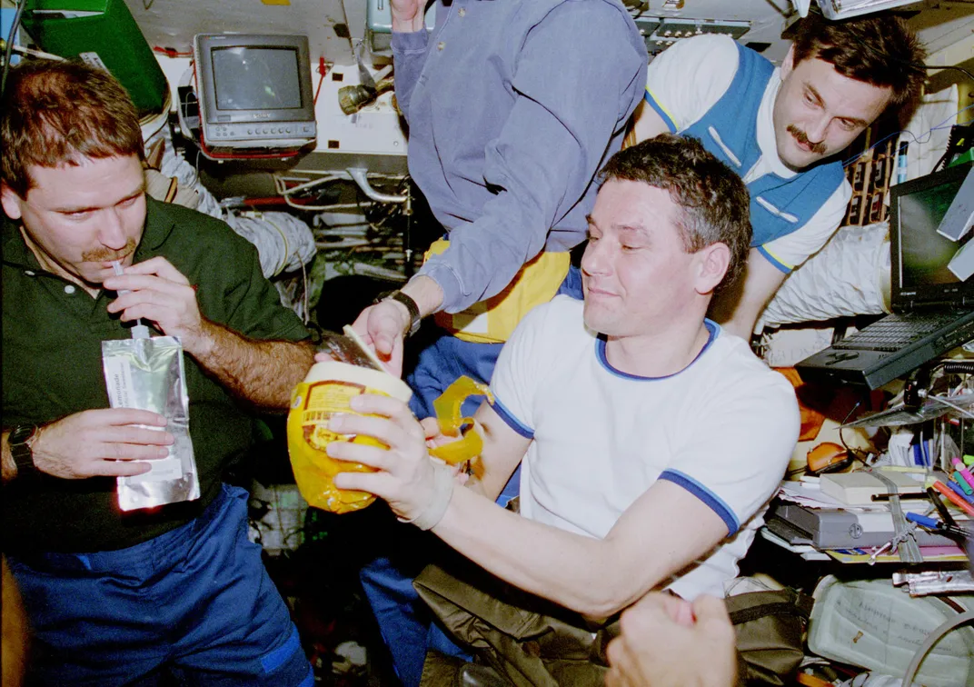 Astronauts Drinking In Space