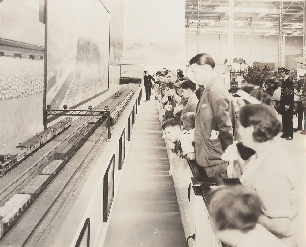 Visitors examine a Pennsylvania Railroad exhibit at the fair