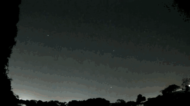 A gif of a meteor exploding over the Floridian night sky  