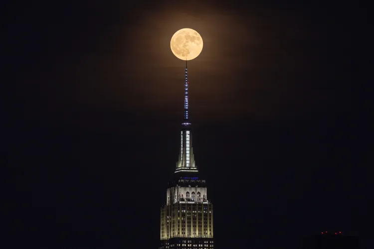 Strawberry moon rises behind the Empire State Building in New York City on June 29, 2026