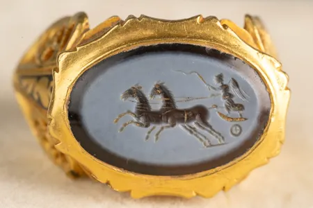 The band is gold and the gem is a nicolo, or &ldquo;little onyx.&rdquo;