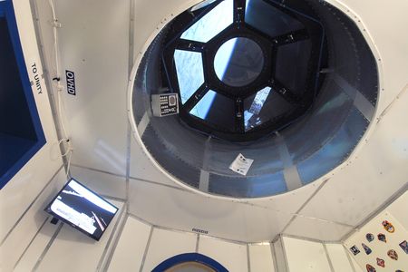 A view of Earth from a replica of the Cupola Observation Module.