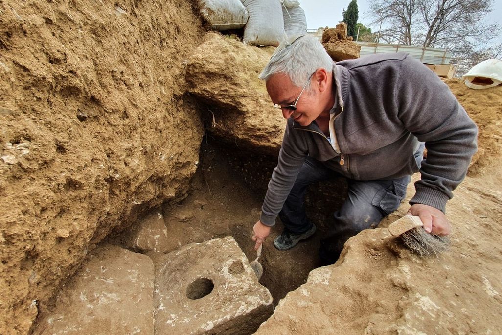 Archaeologists examines the toilet