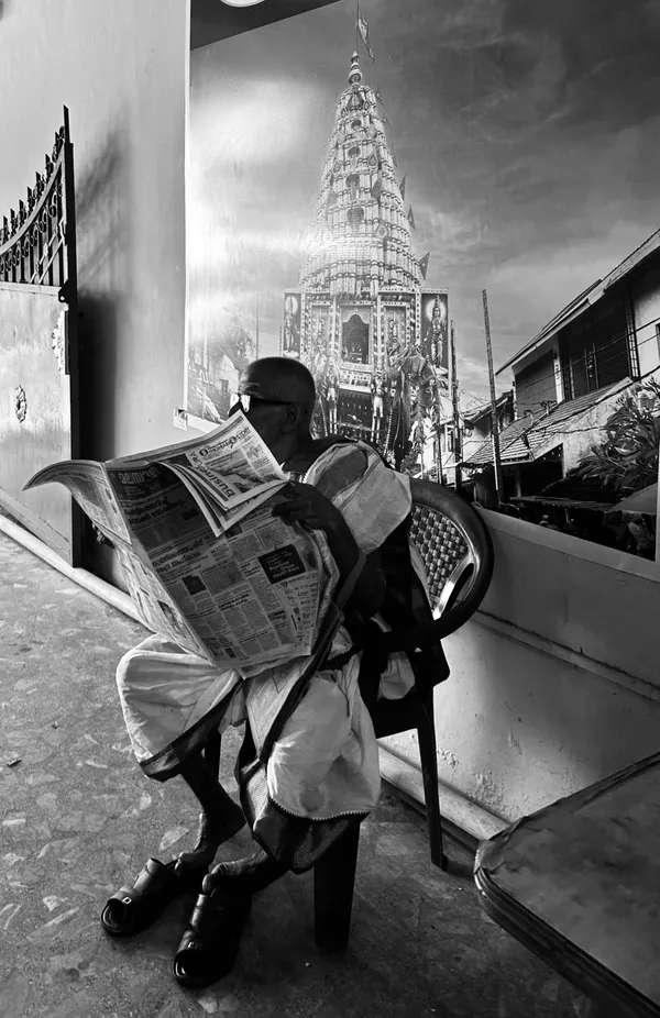 Elderly man reading a newspaper thumbnail