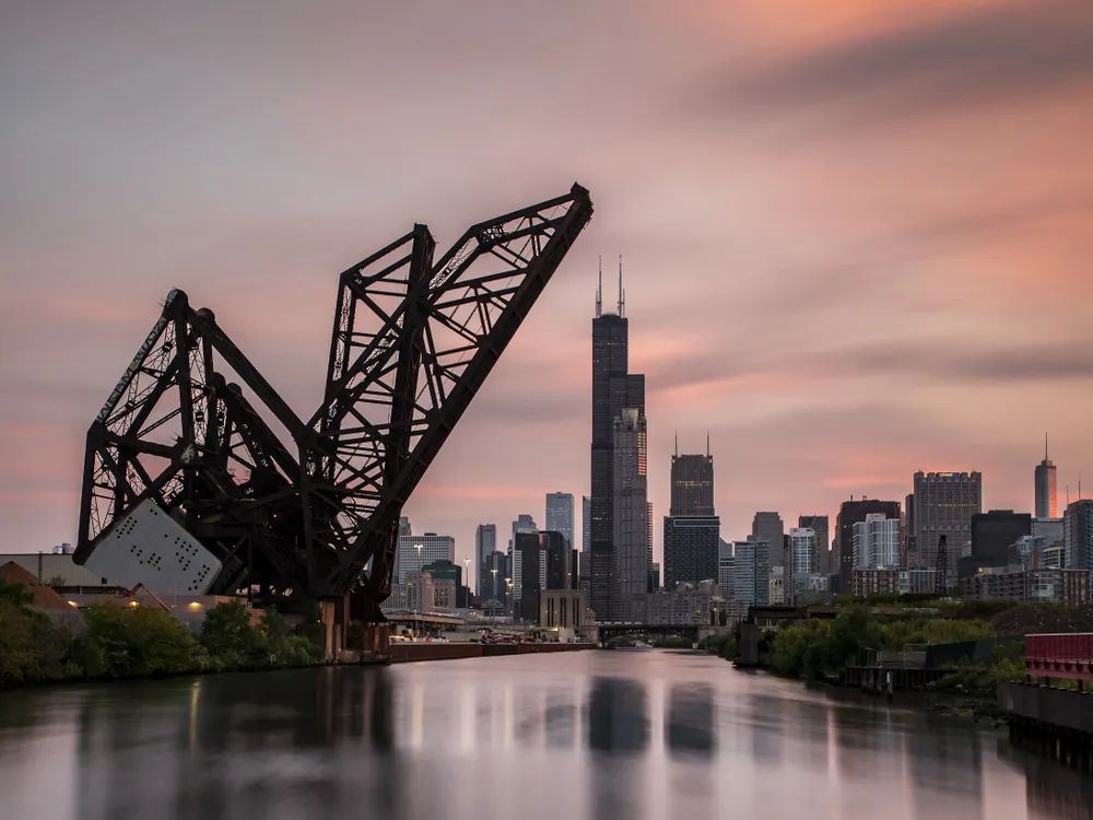 OPENER - Built in 1917-1919, the St. Charles Air Line Bridge is one of the oldest in Chicago and has been designated a city landmark. It’s still in use for freight and cargo trains, and it lifts for boats and ships passing underneath.
