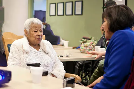 Marta Martínez interviews a local resident for her oral history project.