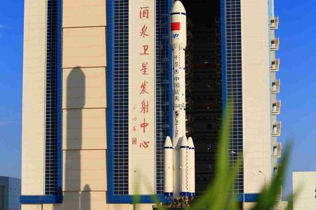 Tiangong-2 heads to the launch pad on top of a Long March rocket.
