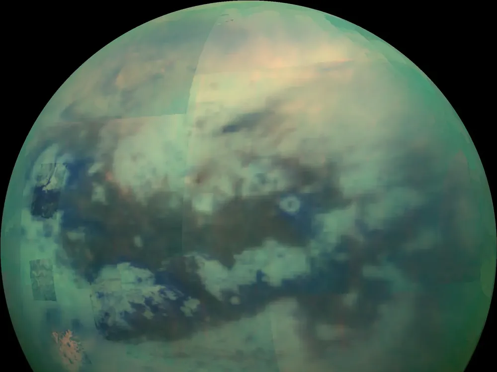 An image of Titan taken by the Cassini rover, which shows the darker dunes on the moon's equatorial surface.