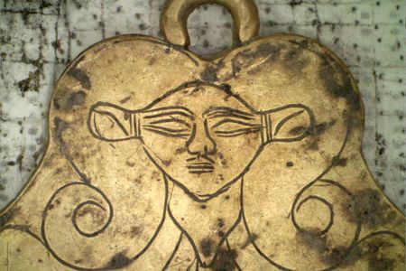 Recent excavations in the ancient Greek city of Pylos revealed a gold pendant featuring the likeness of Hathor, an Egyptian goddess who was a protector of the dead.

