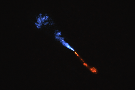 An image from the ALMA telescope array in Chile shows jets of silicon monoxide blowing away from the young star HOPS-315. The blue jet is moving towards Earth, and the red jet is moving away from us.