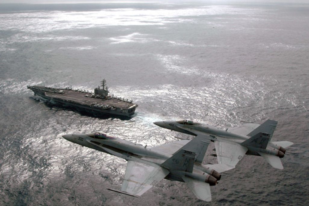 A pair of Hornet pilots hold a change of command ceremony in the sky.