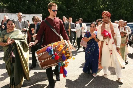 After composing and transcribing music for my wedding day, Red Baraat was born. Dave Sharma leads the baraat (wedding procession) on dhol, as I walk with my mother, family, and friends. August 27, 2005. 