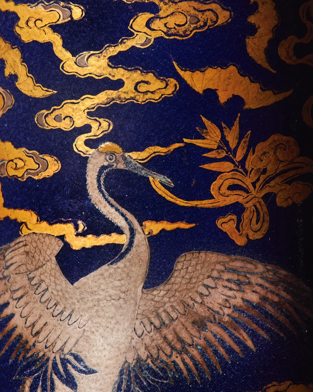Detail shot of the vase showing a crane and clouds
