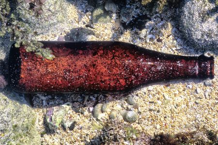 Trash, such as this glass bottle, has been found deep in the ocean, far away from shore.