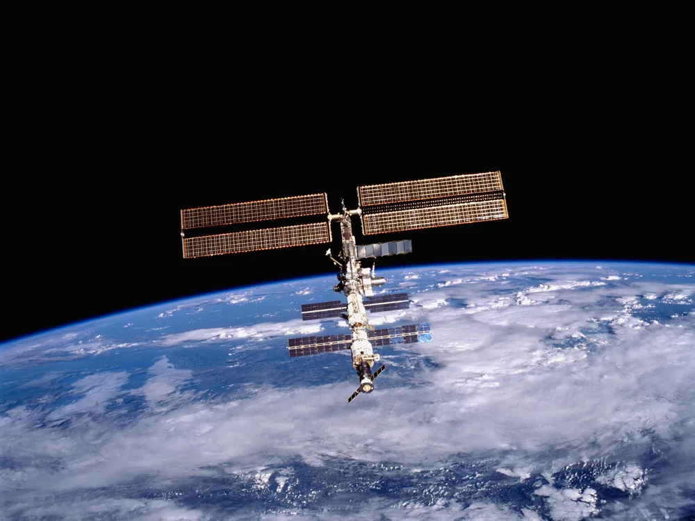A photo of the International Space Station with the Earth in the background