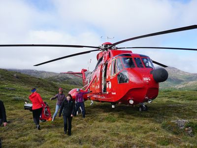 Elizabeth Thomas's team moving between remote field camps via helicopter in Greenland in July 2018