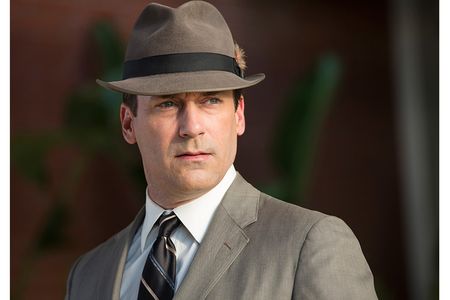 Actor Jon Hamm sporting the iconic fedora and gray suit of his alter ego, Don Draper, from the popular television show "Mad Men." Draper's suit and fedora, along with Betty Francis' yellow housedress and other props were donated to the Smithsonian.