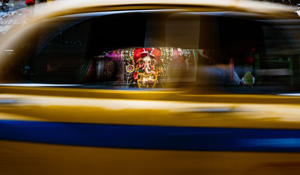 Ganesh Glimpses Through a Yellow Taxi thumbnail