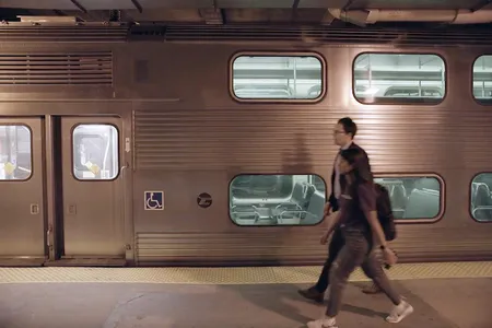 Alessandro Rotta Loria and a student in his lab walk through a train tunnel beneath the Chicago Loop.