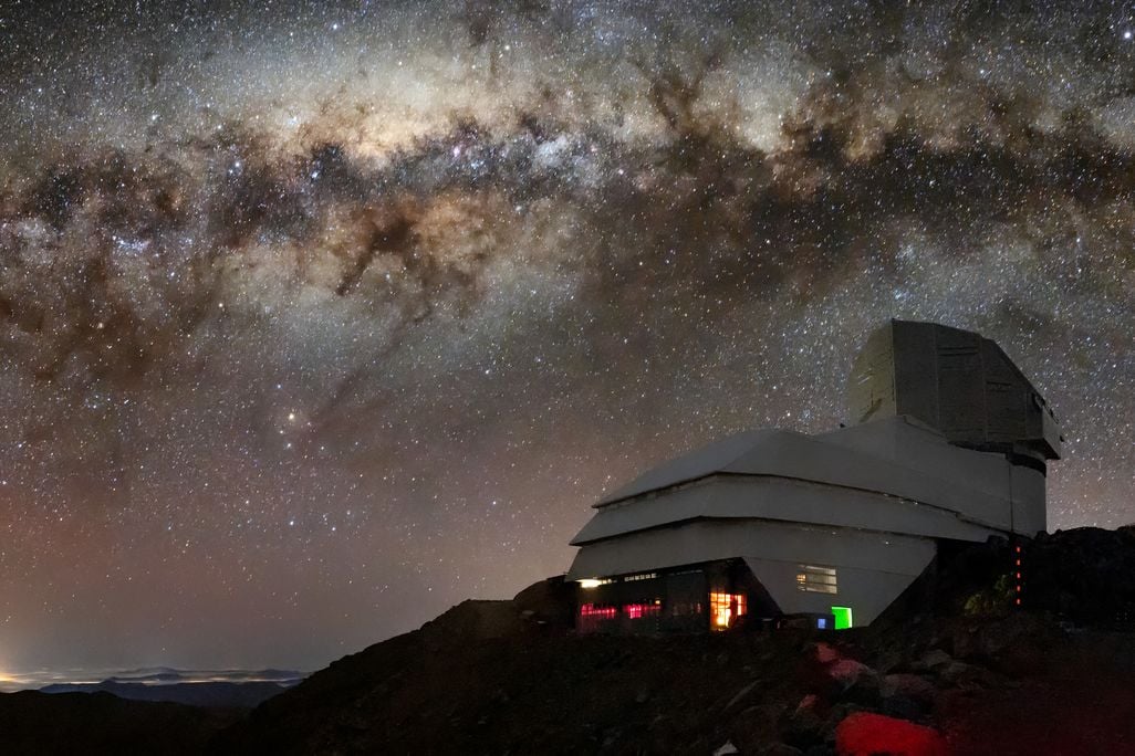 observatory on a mountain against a starry night sky