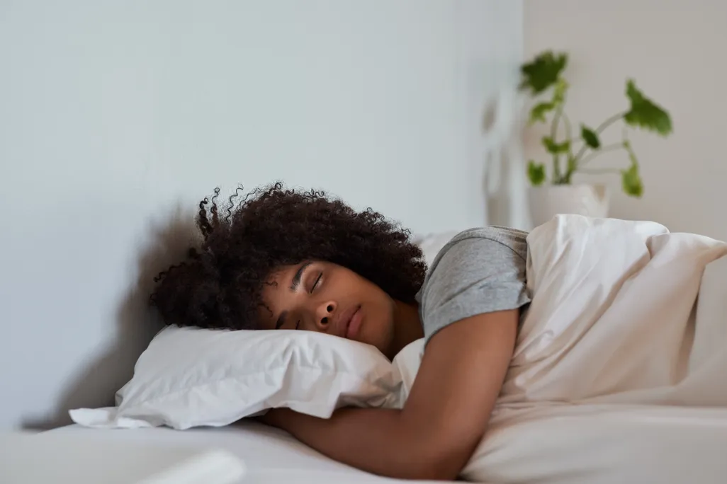 A young women asleep in bed