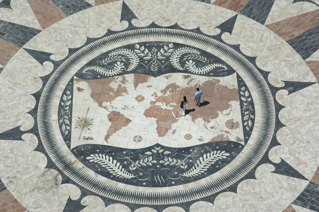 Plaza near the Monument to the Discoveries featuring a large world map