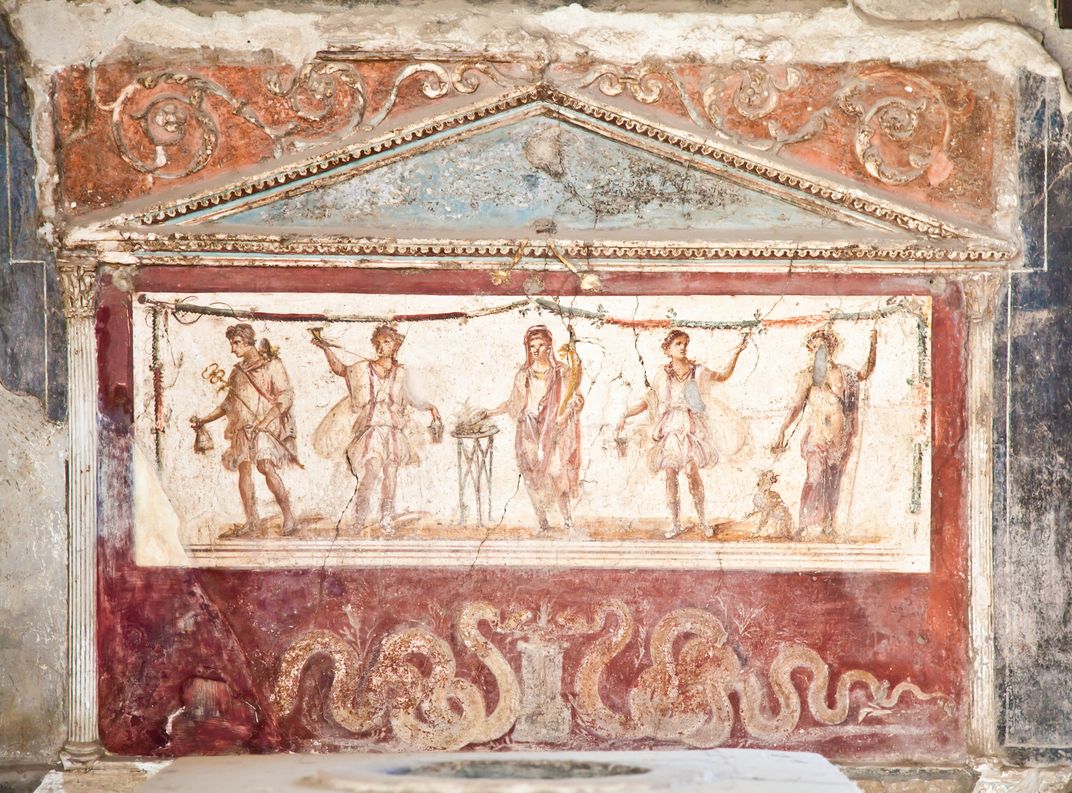 Detail of a painted wall in a house in Pompeii