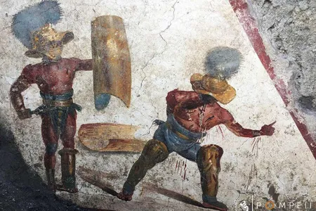 The scene features a wounded gladiator appealing for mercy