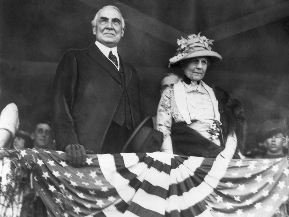 Warren Harding and his wife above patriot bunting