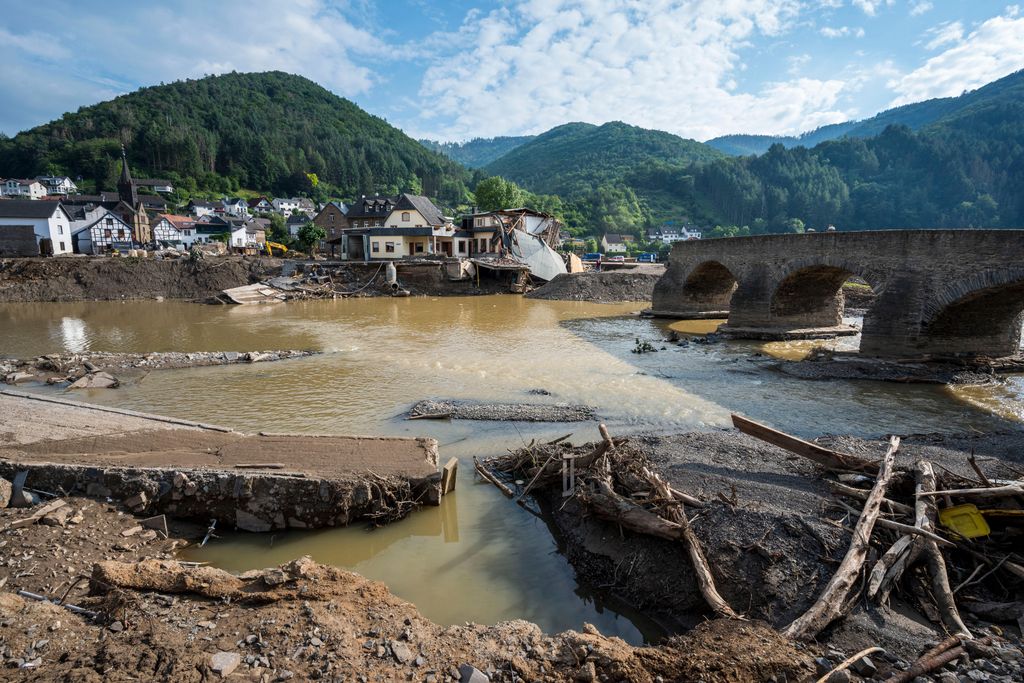 Destroyed houses, roads and a bridge pictured during ongoing cleanup efforts in the Ahr Valley region following catastrophic flash floods on August 04, 2021 in Rech, Germany.