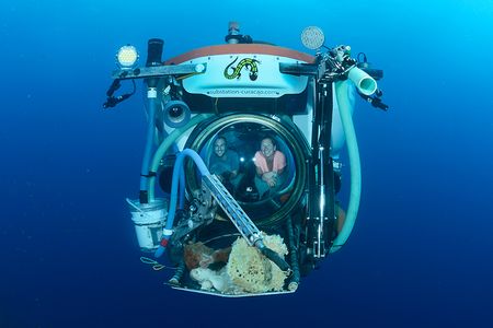 Tamara Schwent and Kevin Curtis, PhD from Sirenas bringing in samples from the deep sea. This was a joint expedition with Chapman Expeditions and the Carmabi Research Station.