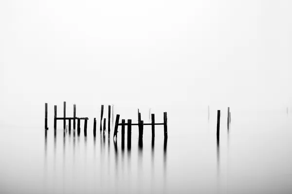 A long exposure on a foggy morning allowed the sky and water to become one. thumbnail