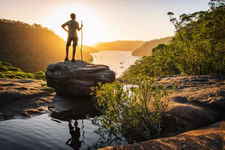 A hiker soaks up the scenery as the sun sets in Ku-Ring-Gai Chase National Park in Sydney.