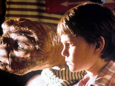 E.T. looks out the window with Elliott (Henry Thomas) in a scene from the 1982 movie.

