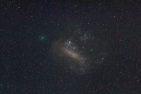 The green object is the comet 252P/LINEAR as it passed by the Larger Megellanic Cloud.