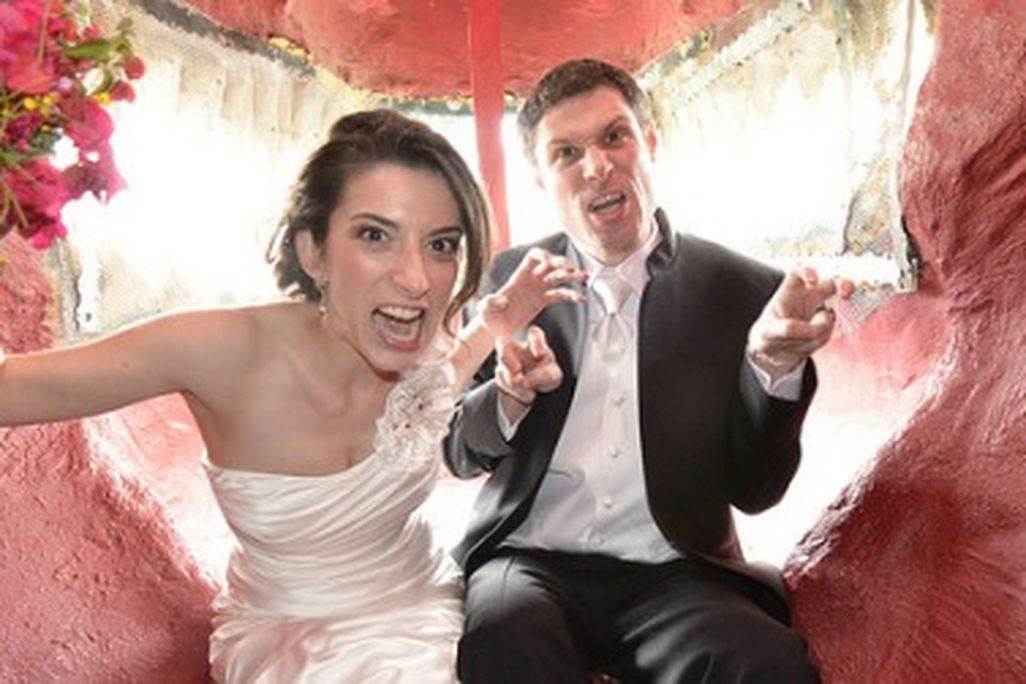 Newlyweds Scott and Amanda Peters inside the mouth of Cabazon Dino Park's Tyrannosaurus