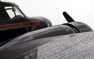 “At the Wing Nuts Flying Circus airshow in Tarkio, Missouri, in July 2008, the black surfaces of a Cessna Bobcat [right] showed every drop of rain beading on its wings and engine cowling, telling the story of a rain delay." - Max Haynes