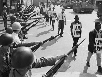 National Guard troops lined Beale Street during a protest on March 29 , 1968. “I was in every march, all of ’em, with that sign: I AM A MAN,” recalls former sanitation worker Ozell Ueal.