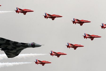 The last remaining Vulcan bomber flies with the Red Arrows over Farnborough on July 9.
