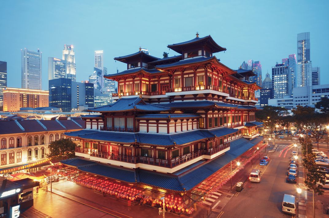The historic Buddha Toothe Relic Temple with business district in the background, Singapore