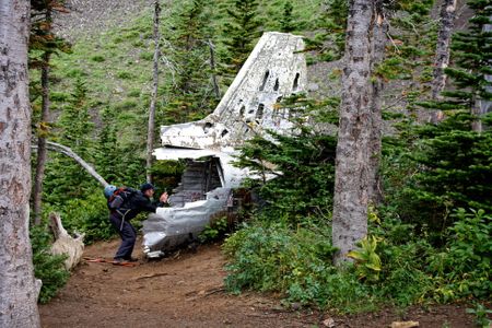 In 2014, backcountry hiker Jeff Lang photographs the tail of a downed Royal Canadian Air Force DC-3 Dakota on Mount Coulthard, Alberta, Canada. The airplane crashed in 1946 while en route from Comox, British Columbia to Greenwood, Nova Scotia, killing all seven on board.
