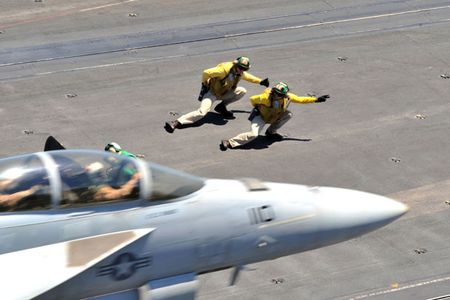 110627-N-CH661-028
MEDITERRANEAN SEA (June 27, 2011) A shooter under instruction mirrors his trainer as they launch an F/A-18F Super Hornet assigned to the Red Rippers of Strike Fighter Squadron (VFA) 11 from catapult three aboard the aircraft carrier USS Enterprise (CVN 65). The Enterprise Carrier Strike Group is supporting maritime security operations and theater security cooperation efforts in the U.S. 6th Fleet area of responsibility. (U.S. Navy photo by Mass Communication Specialist 3rd Class Jared M. King/Released)