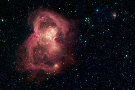 A nursery for hundreds of baby stars is revealed in this infrared image from NASA's Spitzer Space Telescope.