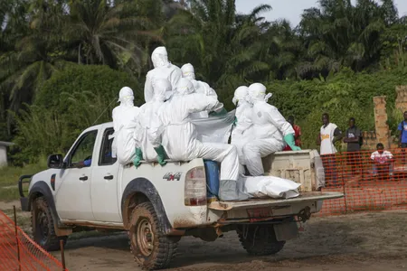 Health workers burying an Ebola victim in Liberia