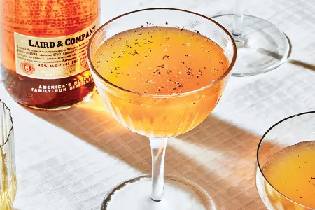 An applejack sour combines lemon juice, orange juice, maple syrup and Angostura bitters, plus a little nutmeg.&nbsp;