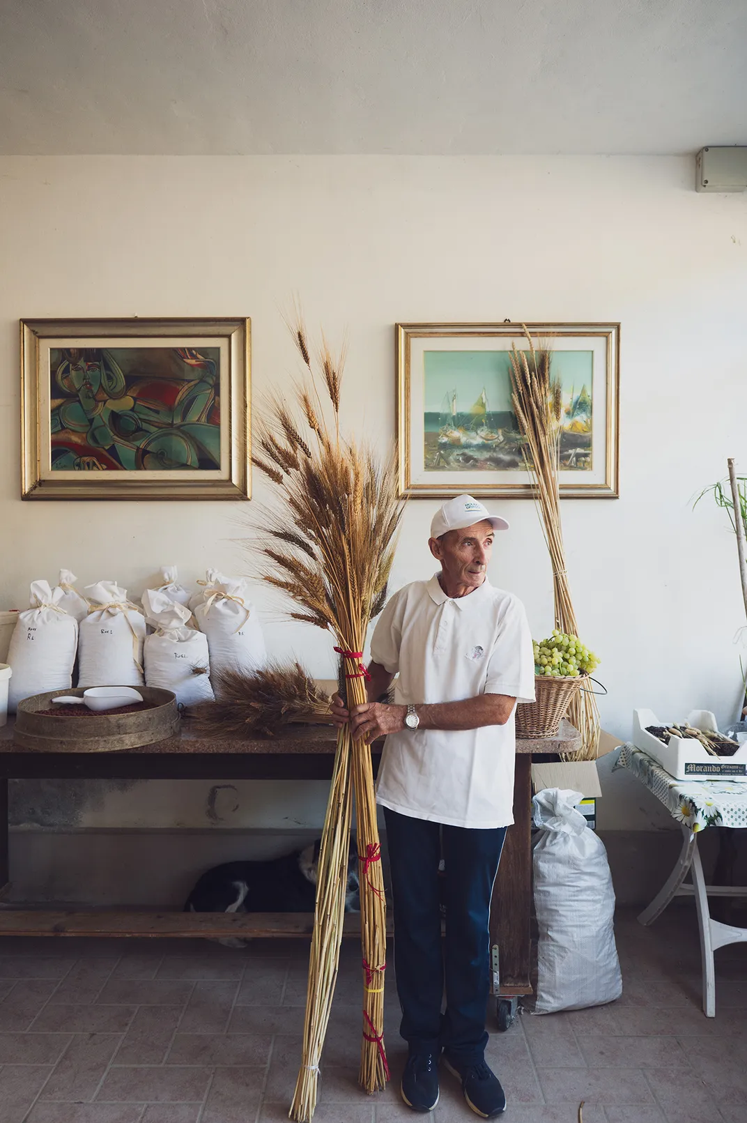 Grossi holds sheaves of his grain